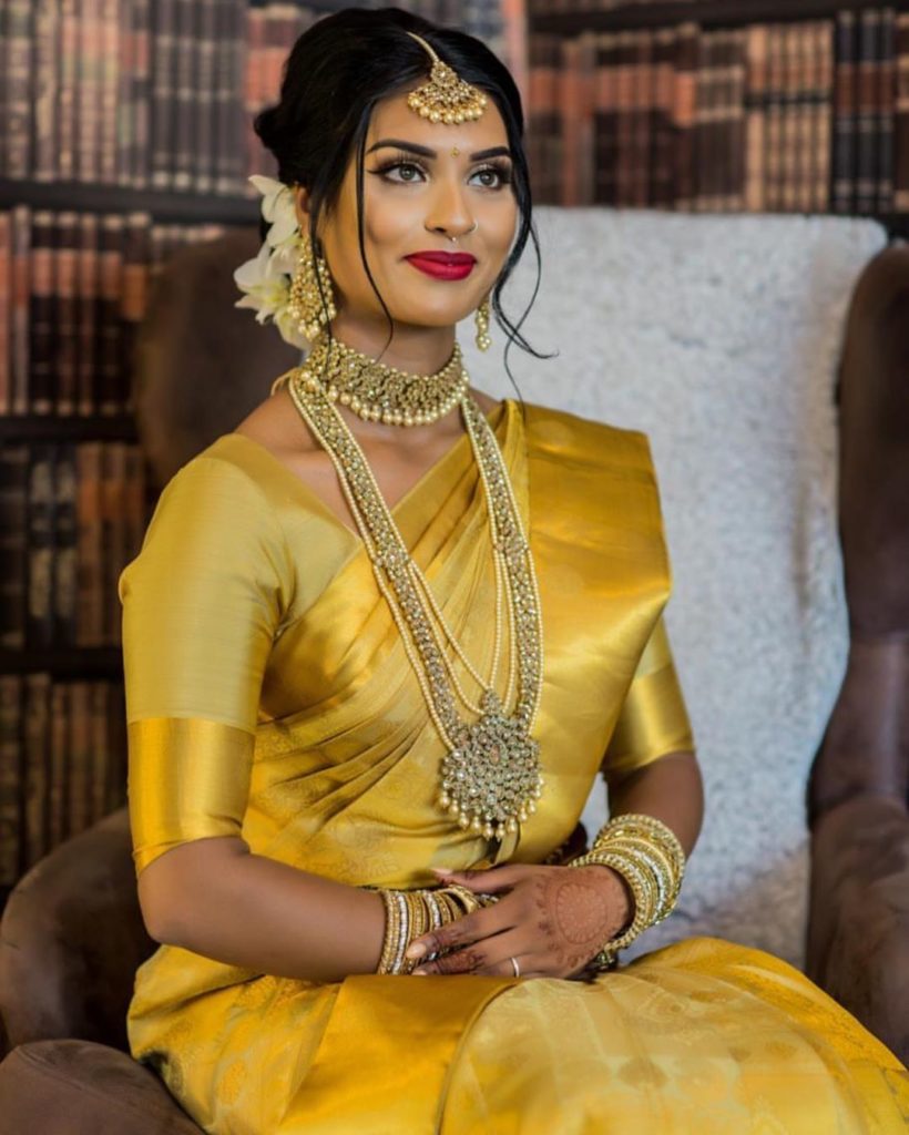 Artistry by Olivia - South-Indian bridal look. Thick kohl and peach lips to  compliment her heavy worked blouse and gold Saree. Makeup:  @artistrybyolivia . . . Hairstylist: @jayashree_hairstylist Wardrobe:  @anjushankar_29 Jewellery: @vivahbridalcollections